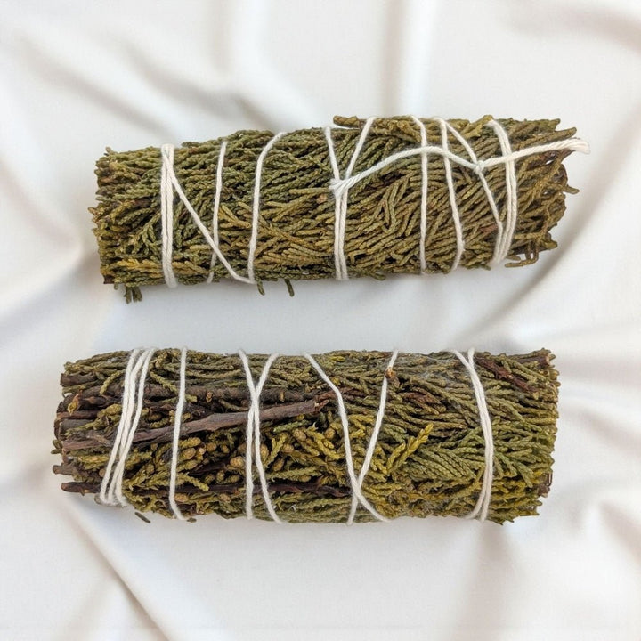 Two pure juniper bundle for protection and cleansing tied with twine on a white background available at zen collection metaphysical crystal store