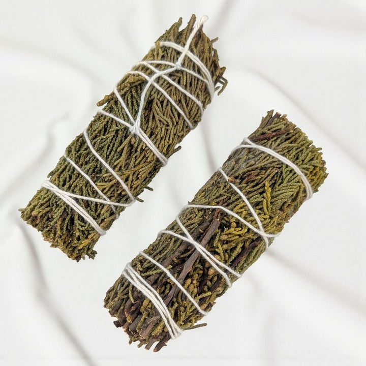Two pure juniper bundle for protection and cleansing tied with white string on a light background available at barrie crystal store