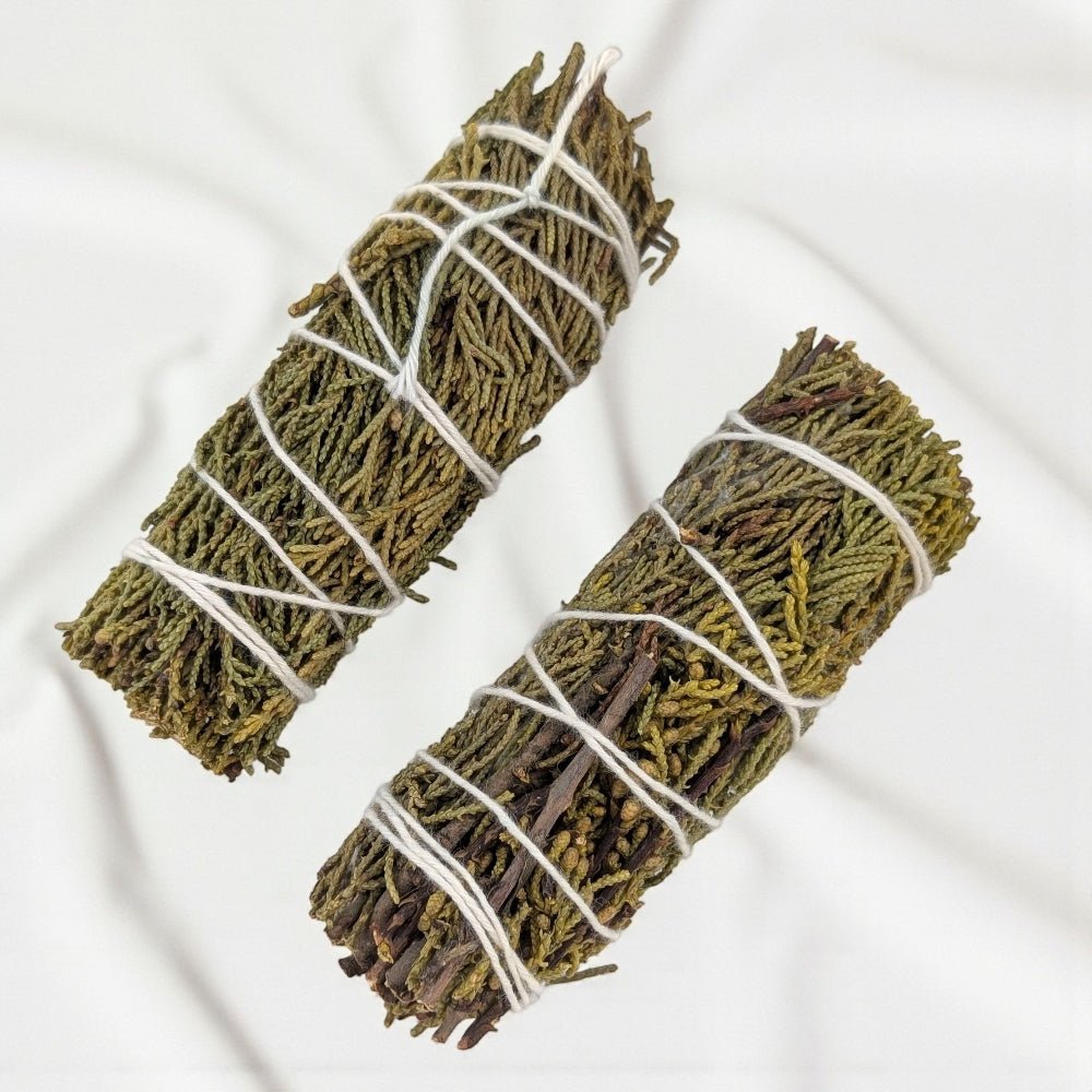 Two pure juniper bundle for protection and cleansing tied with white string on a light background available at barrie crystal store