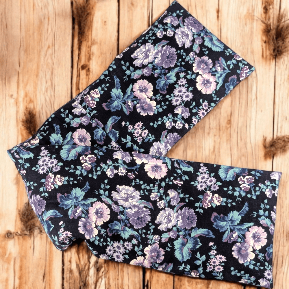 Close-up of purple floral cotton fabric on neck wrap