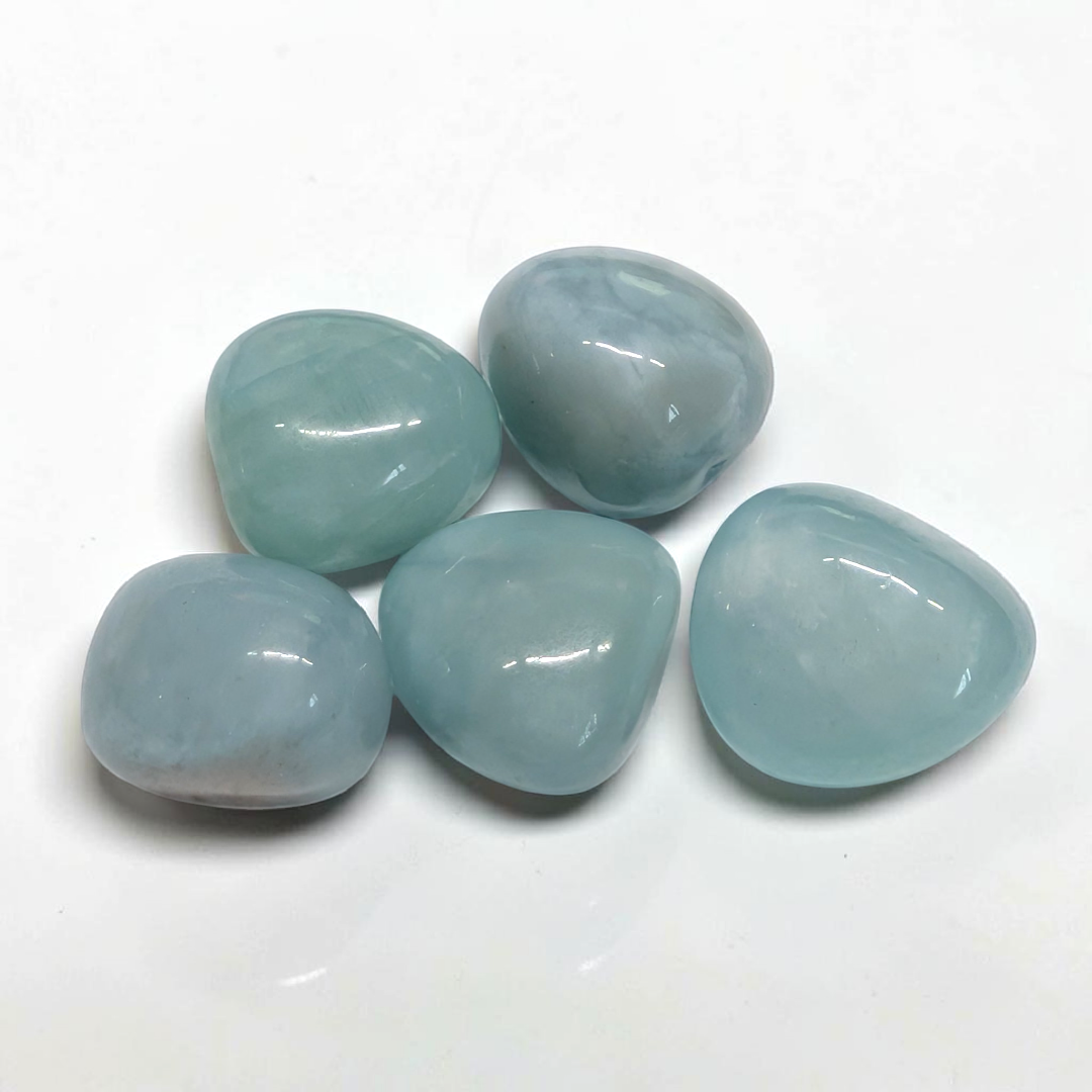 Translucent pale blue tumbled Aquamarine pocket stone for courage and emotional flow
