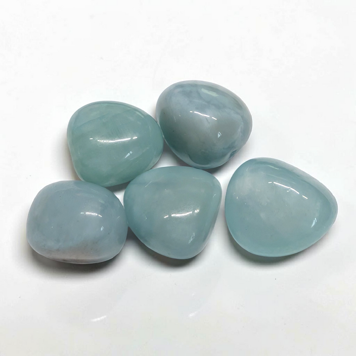 Translucent pale blue tumbled Aquamarine pocket stone for courage and emotional flow