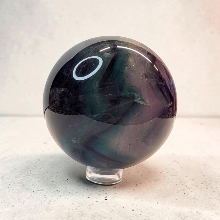 Rainbow fluorite crystal sphere, 287 grams, 2 inch round, banded purple and green fluorite