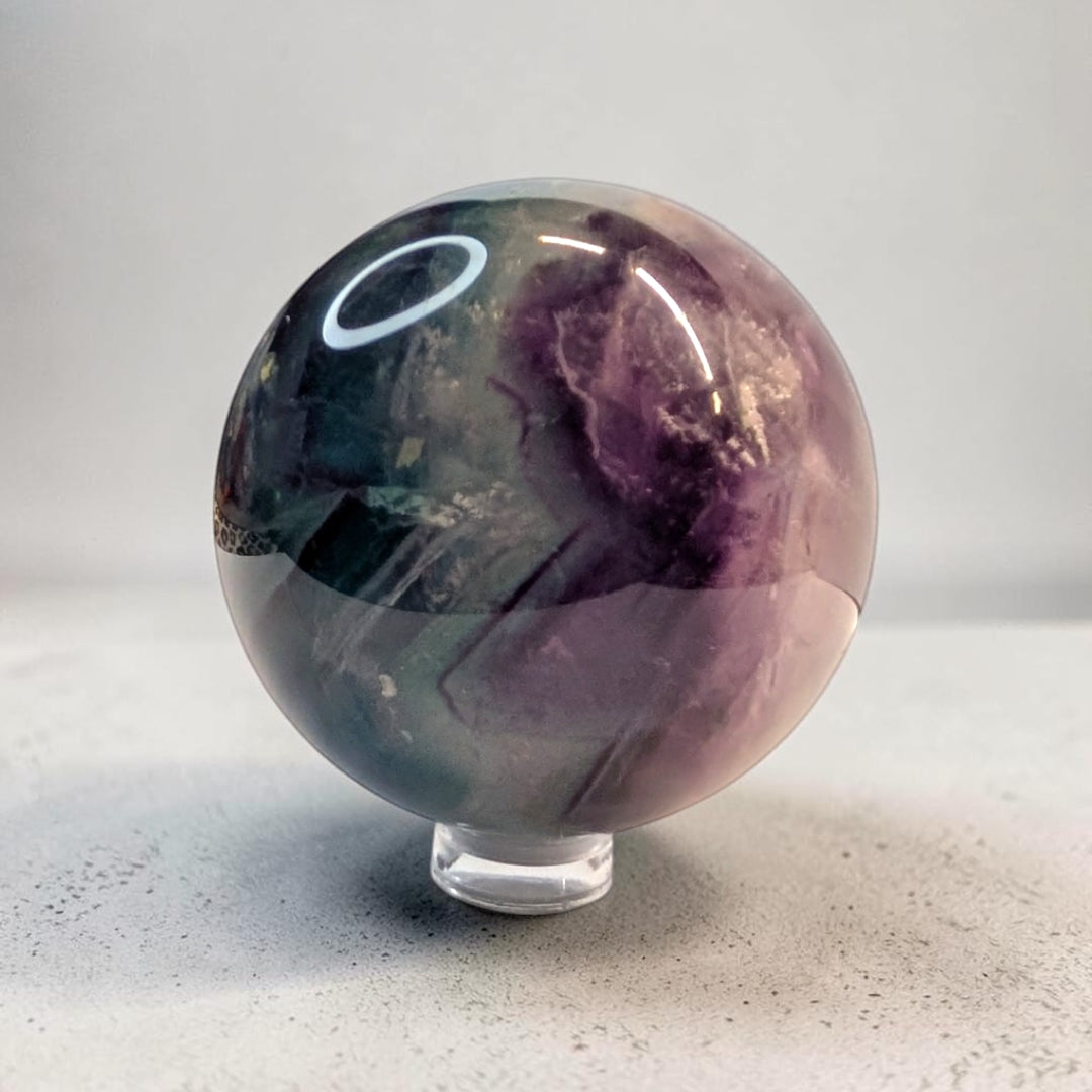 Rainbow fluorite crystal sphere, 287 grams, 2 inch round, banded purple and green fluorite