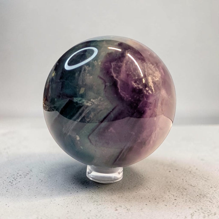 Rainbow fluorite crystal sphere, 287 grams, 2 inch round, banded purple and green fluorite