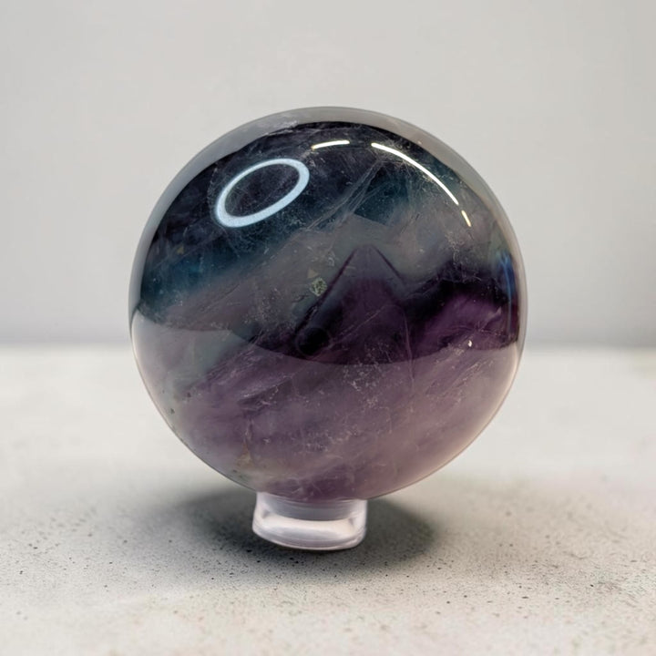 Rainbow fluorite crystal sphere, 287 grams, 2 inch round, banded purple and green fluorite