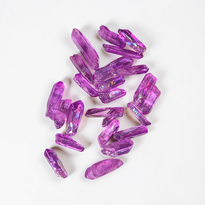 Vibrant purple Aura Quartz crystal point for focused intention and spiritual work