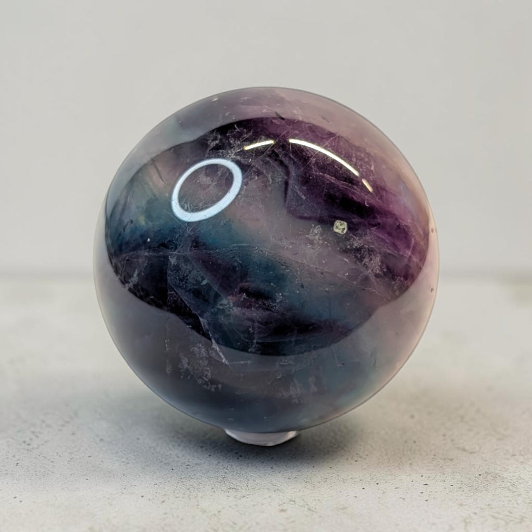 Rainbow fluorite crystal sphere, 287 grams, 2 inch round, banded purple and green fluorite