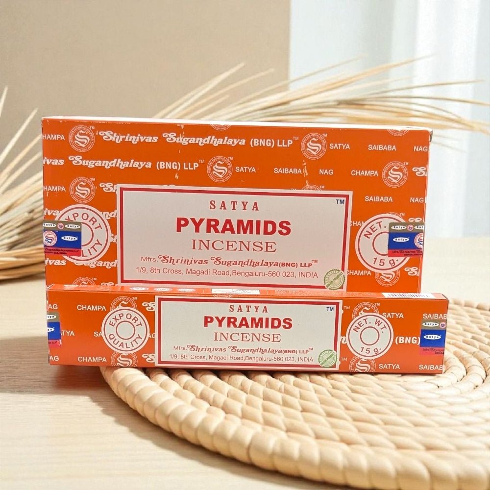 Two boxes of Satya Pyramids Incense on a woven mat with a neutral background. Incense near me in Barrie Crystal Stops