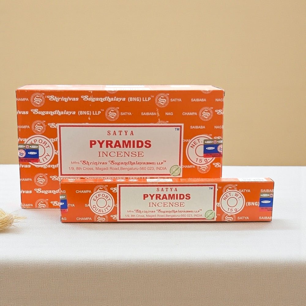 Two boxes of Satya Pyramids Incense on a beige surface with a beige background. incense near me is available at zen collection crystal stores Barrie
