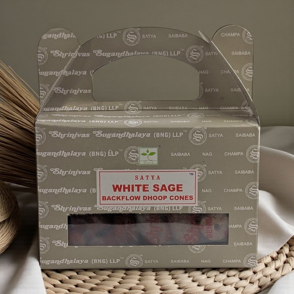Box of Satya White Sage Backflow Dhoop Cones on a woven surface. incense near me available at zen collection spiritual store barrie