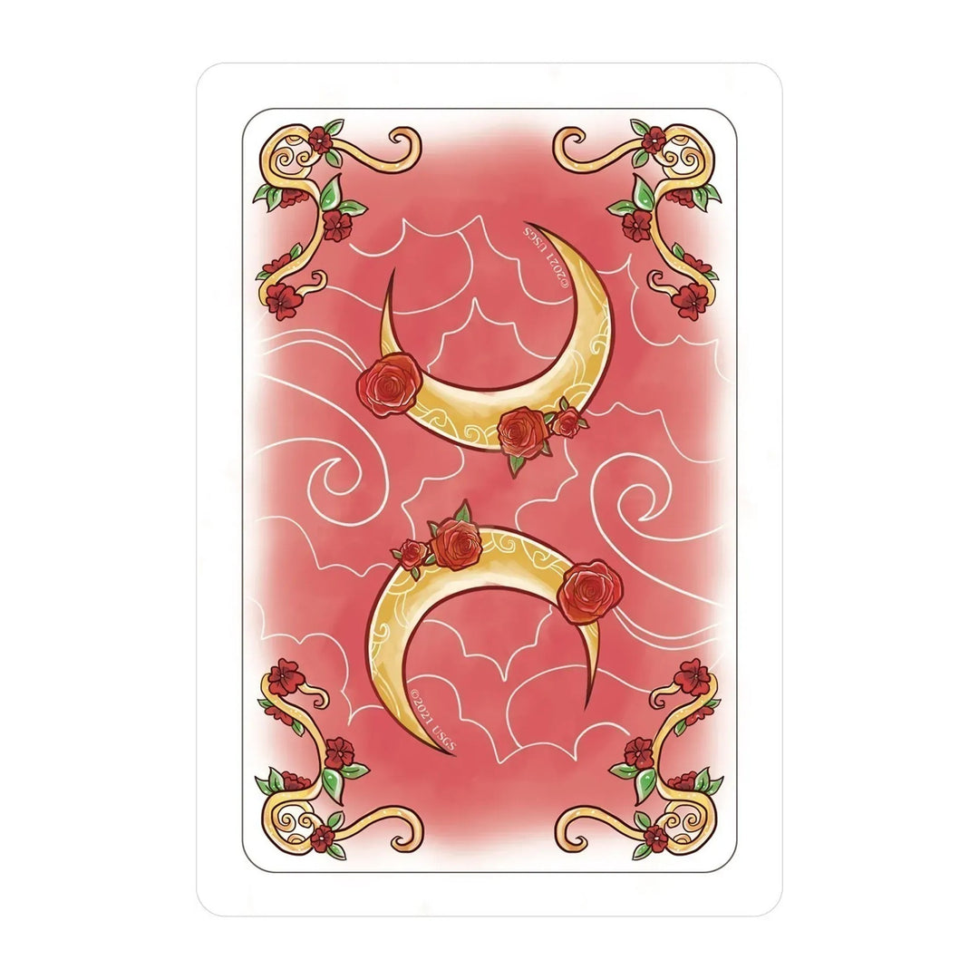 Card back of the Simplicity Tarot, with gold crescent moons and roses