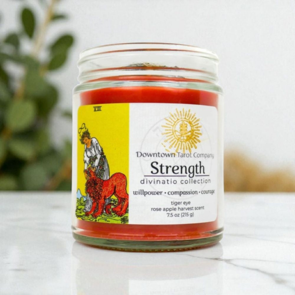 strength candle with tiger’s eye crystal inside