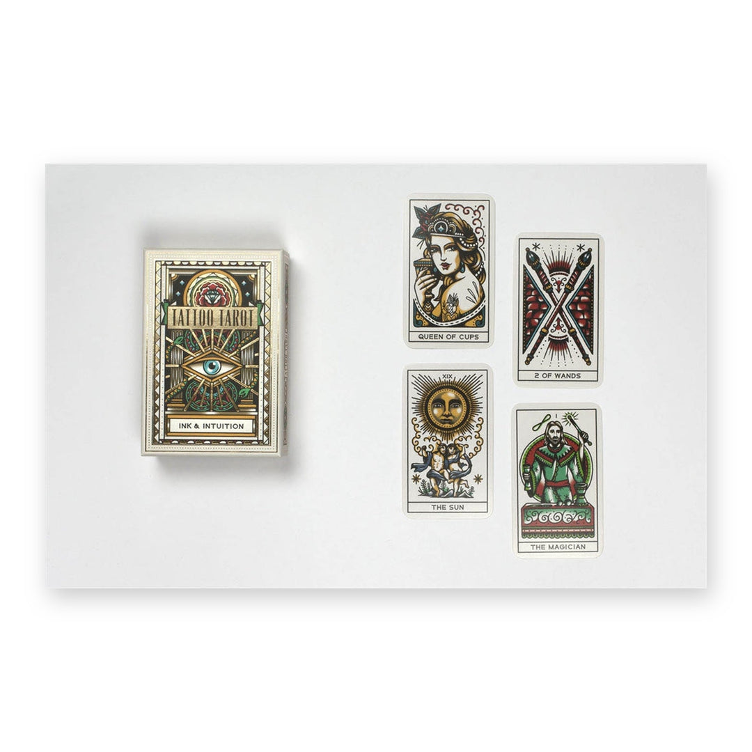 Tattoo Tarot box with four cards: Queen of Cups, Two of Wands, The Sun and The Magician