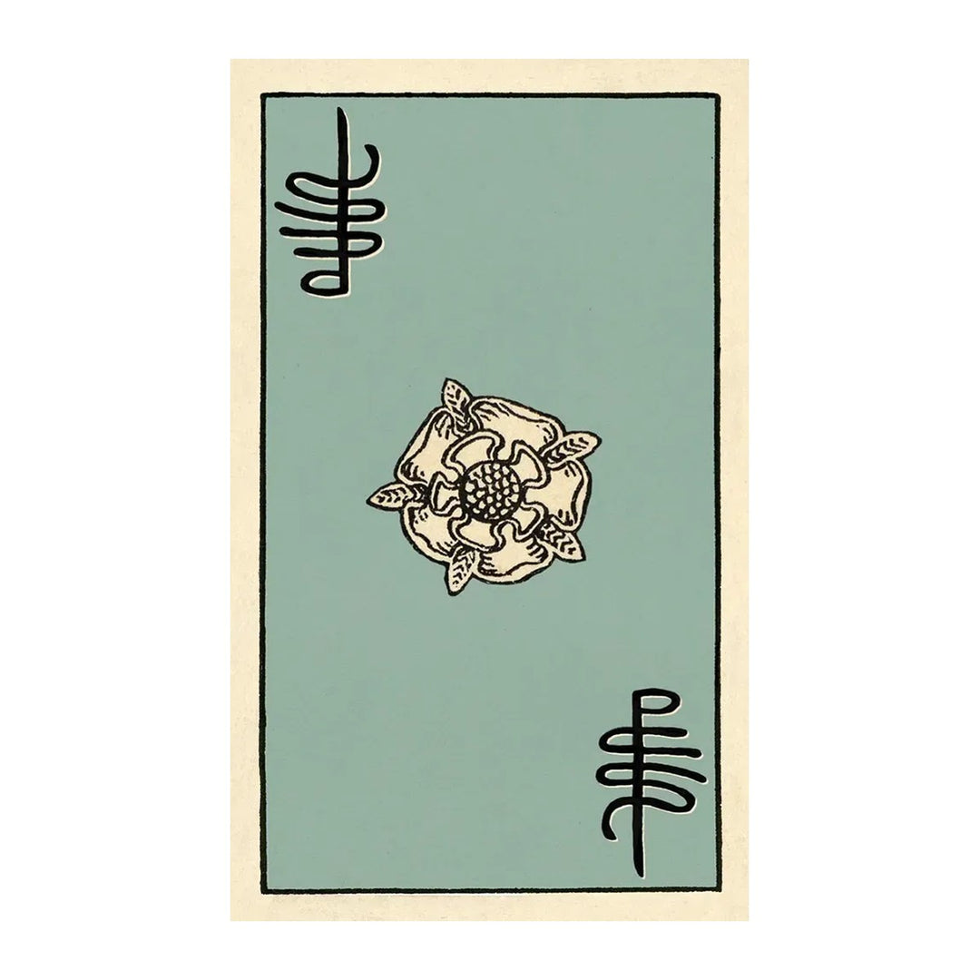 Card back of The Pamela Colman Smith Commemorative Set deck, with a white rose on sage green