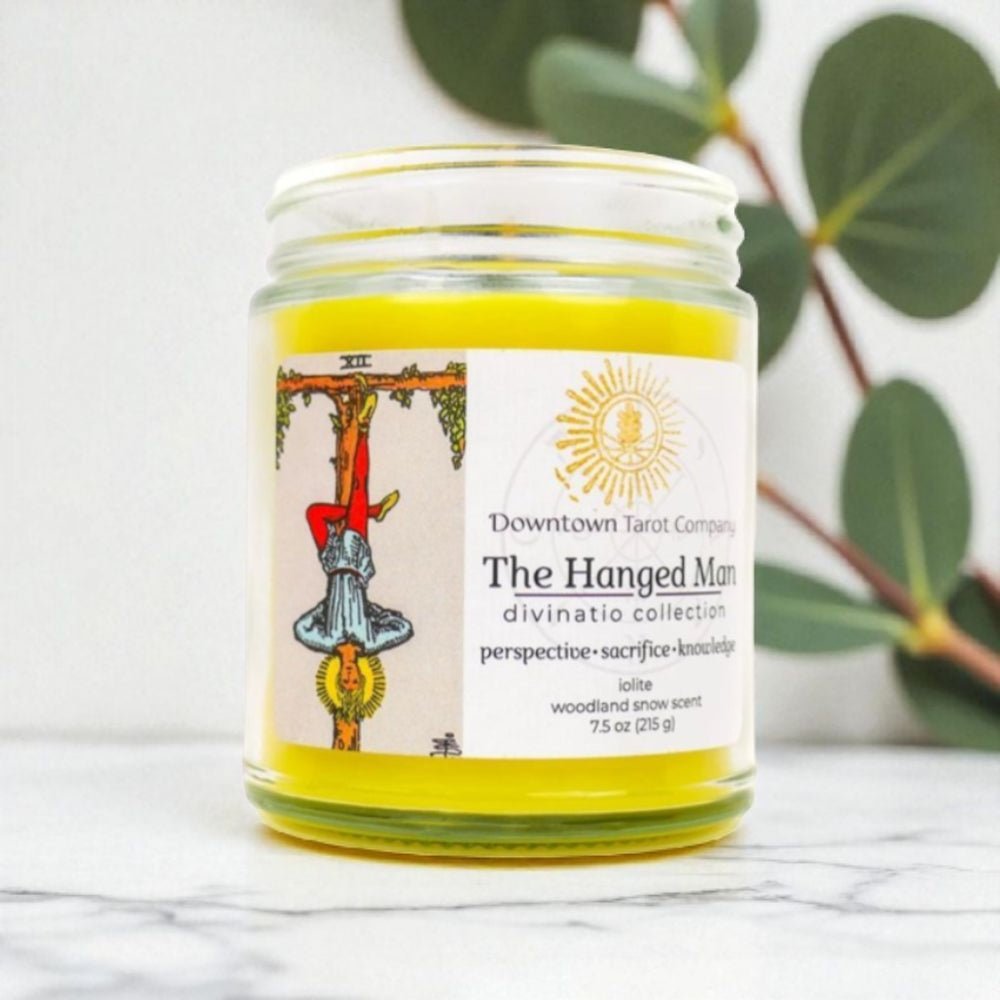 Candle jar with a label featuring tarot card art on a white background available at Zen Collection metaphysical store barrie