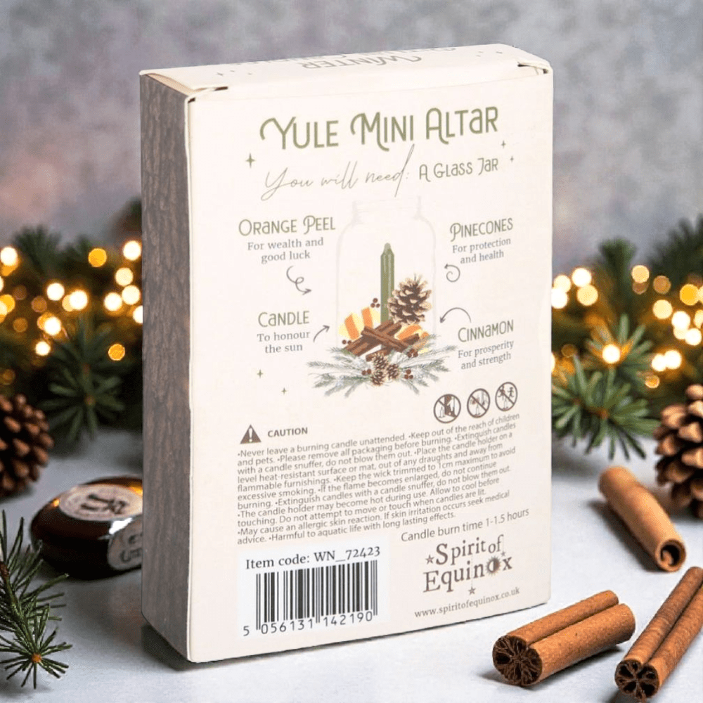 Yule spell candles  with cinnamon sticks and pinecones on a festive background. Available at Zen Collection Crystal Stores Near Me
