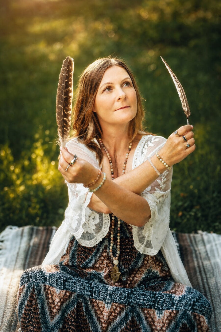 Zen Collection co-founder Krista in a sunlit outdoor ritual setting