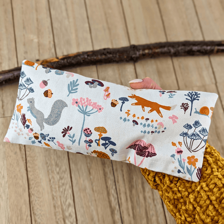 Eye pillow with forest animals and floral accents for relaxation